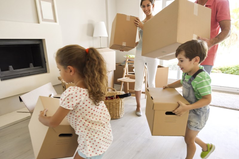family-carrying-moving-boxes